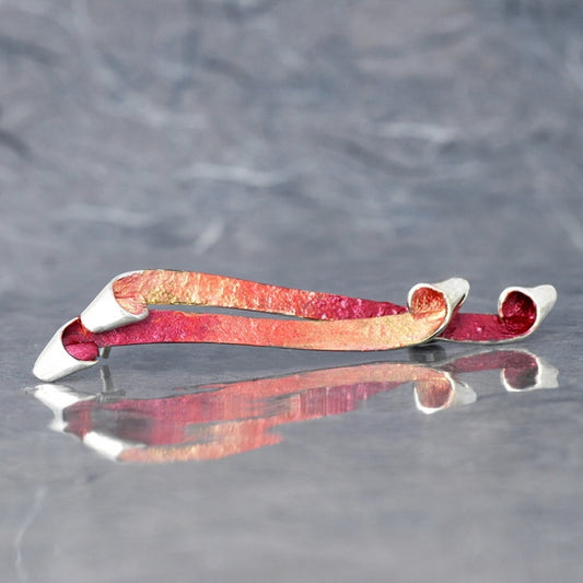 Broche rojizo, colección Bakú