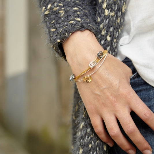 Madison triple, Pulsera de hilos