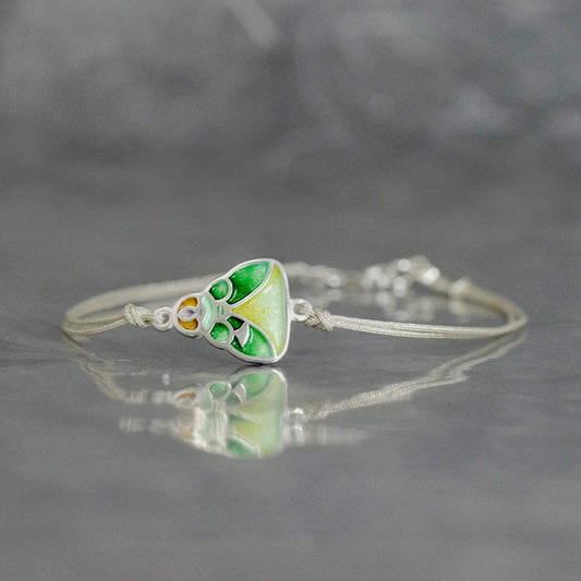 Menina, Pulsera de hilos con esmalte al fuego